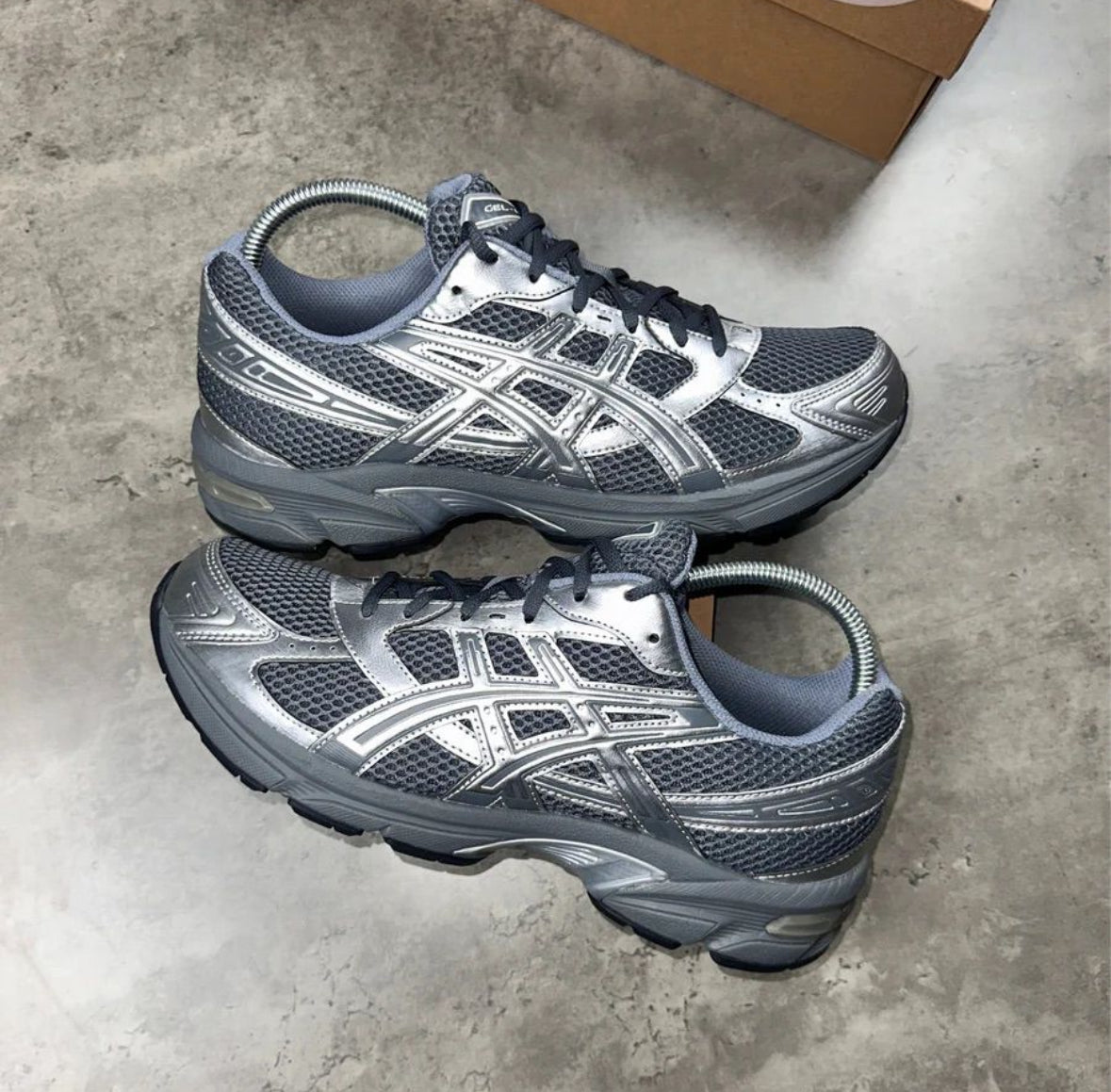 grey and silver trainers