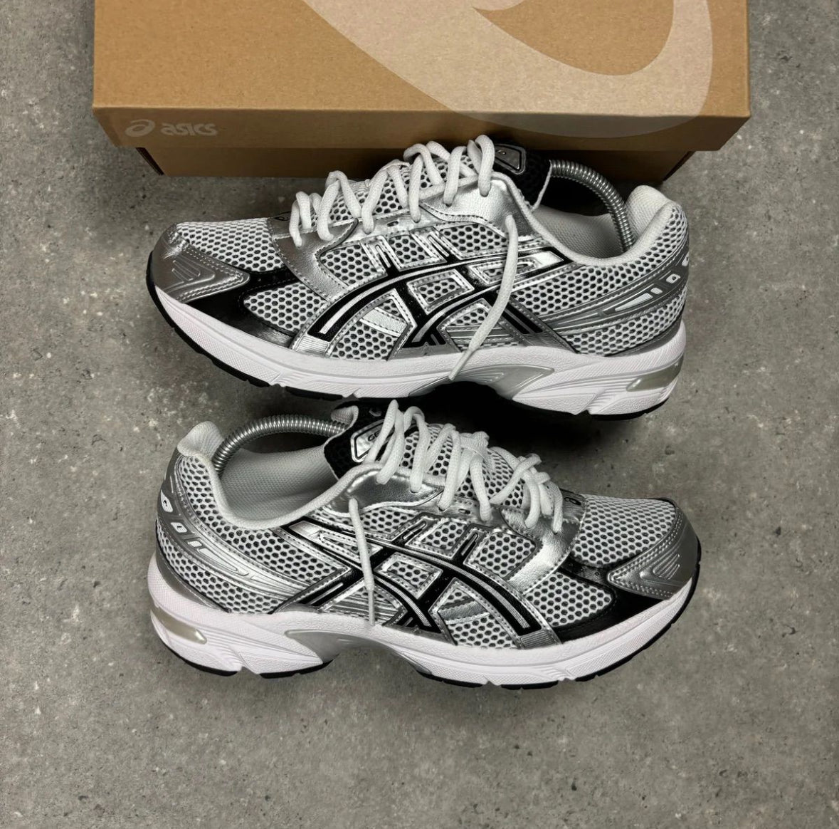 white and grey trainers